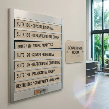 ADA and wayfinding signs in a commercial lobby