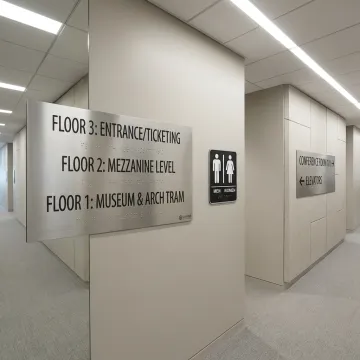 ADA Braille signage in a commercial hallway
