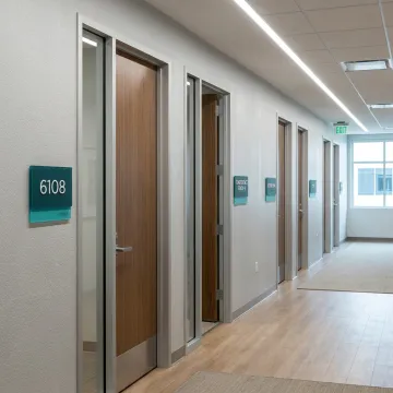 ADA signage displayed in a commercial hallway