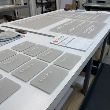 ADA signage being prepared for a sign company order