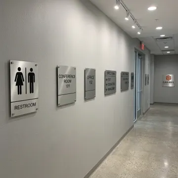 ADA signage in a commercial hallway