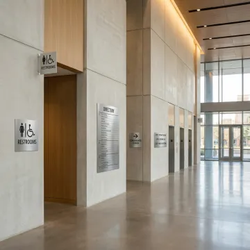 ADA and wayfinding signs in a Dallas commercial building
