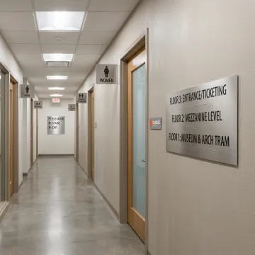 ADA signage installed in a commercial hallway