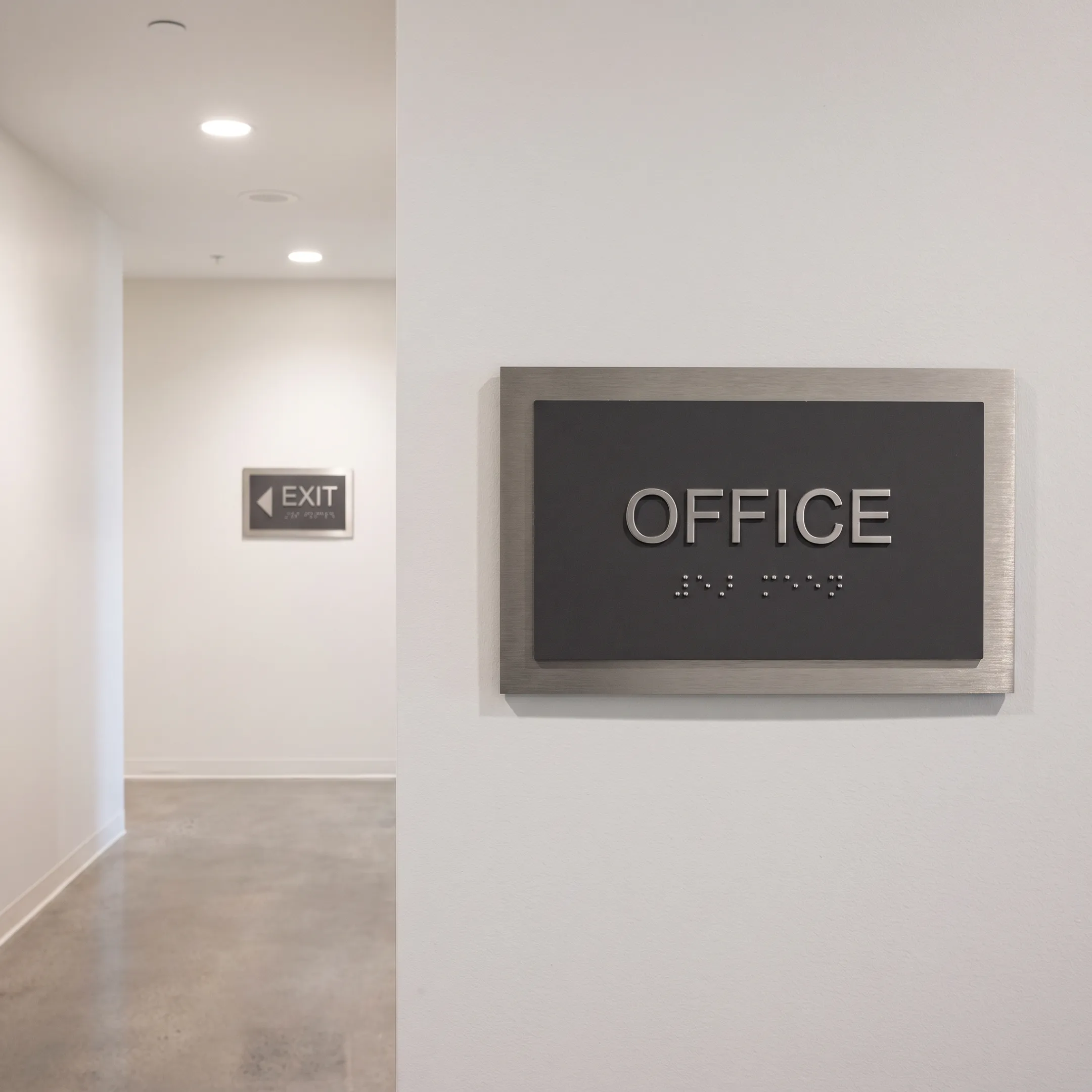 ADA signage installed in a commercial hallway