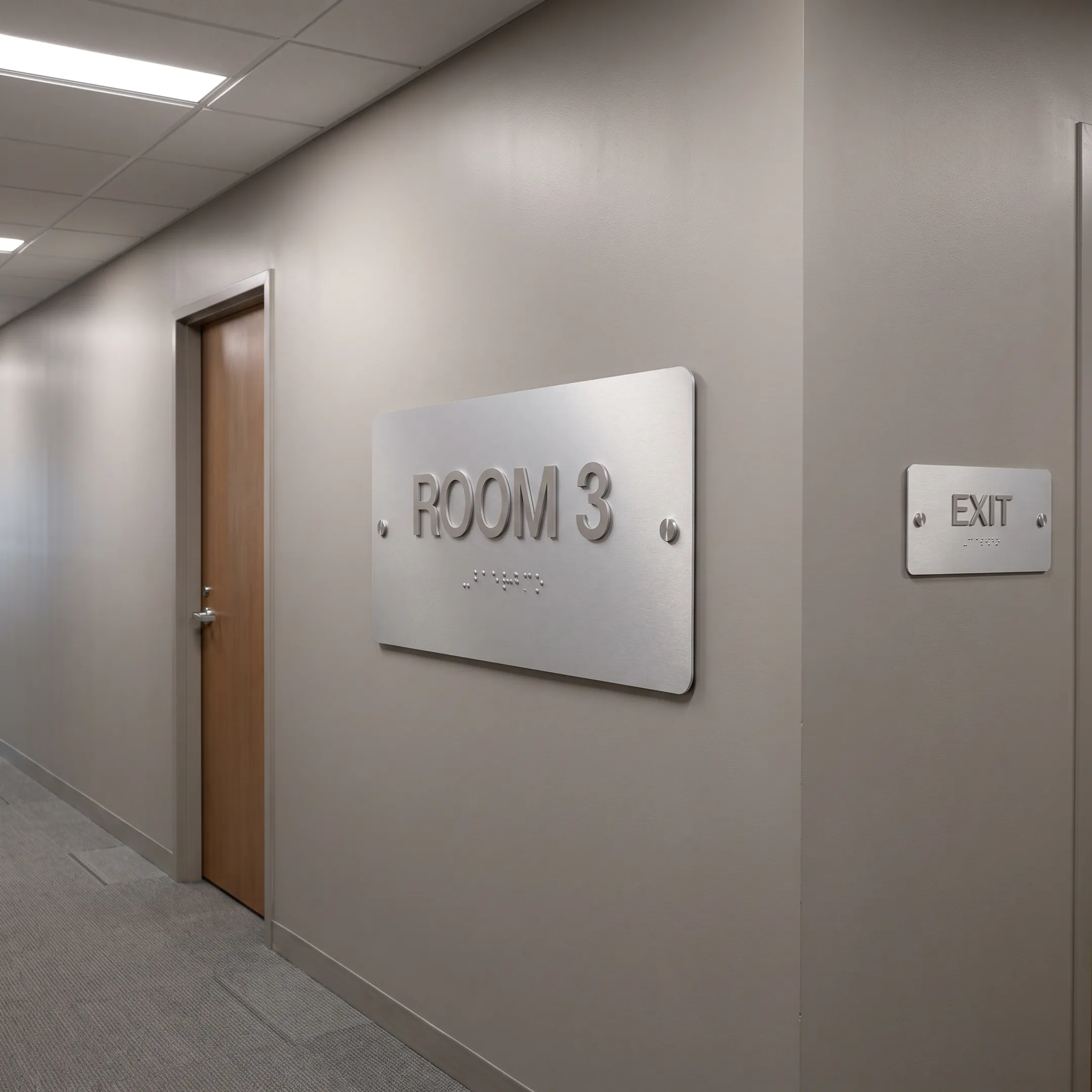 ADA office signs in a commercial hallway