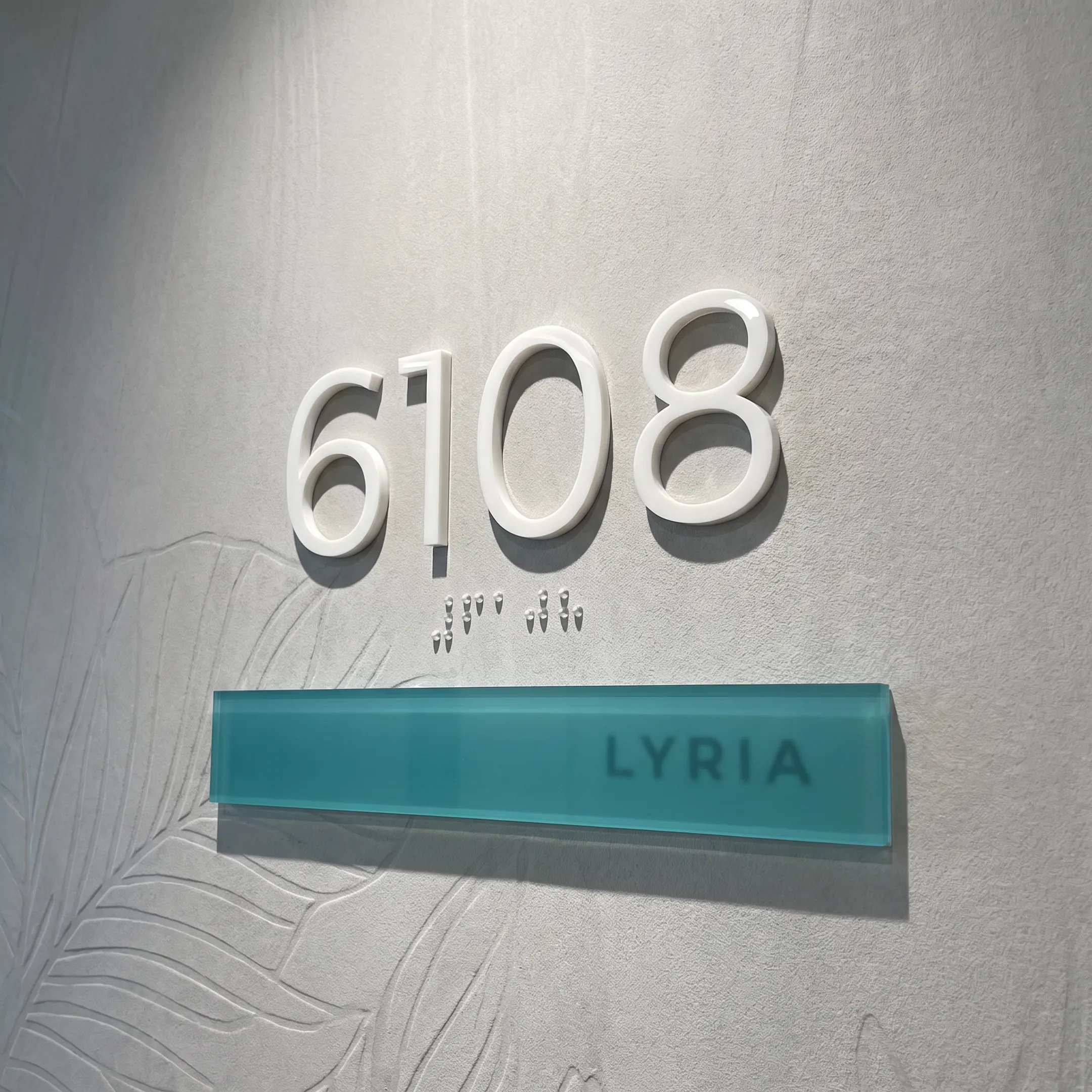 Custom acrylic dimensional letters on a reception wall