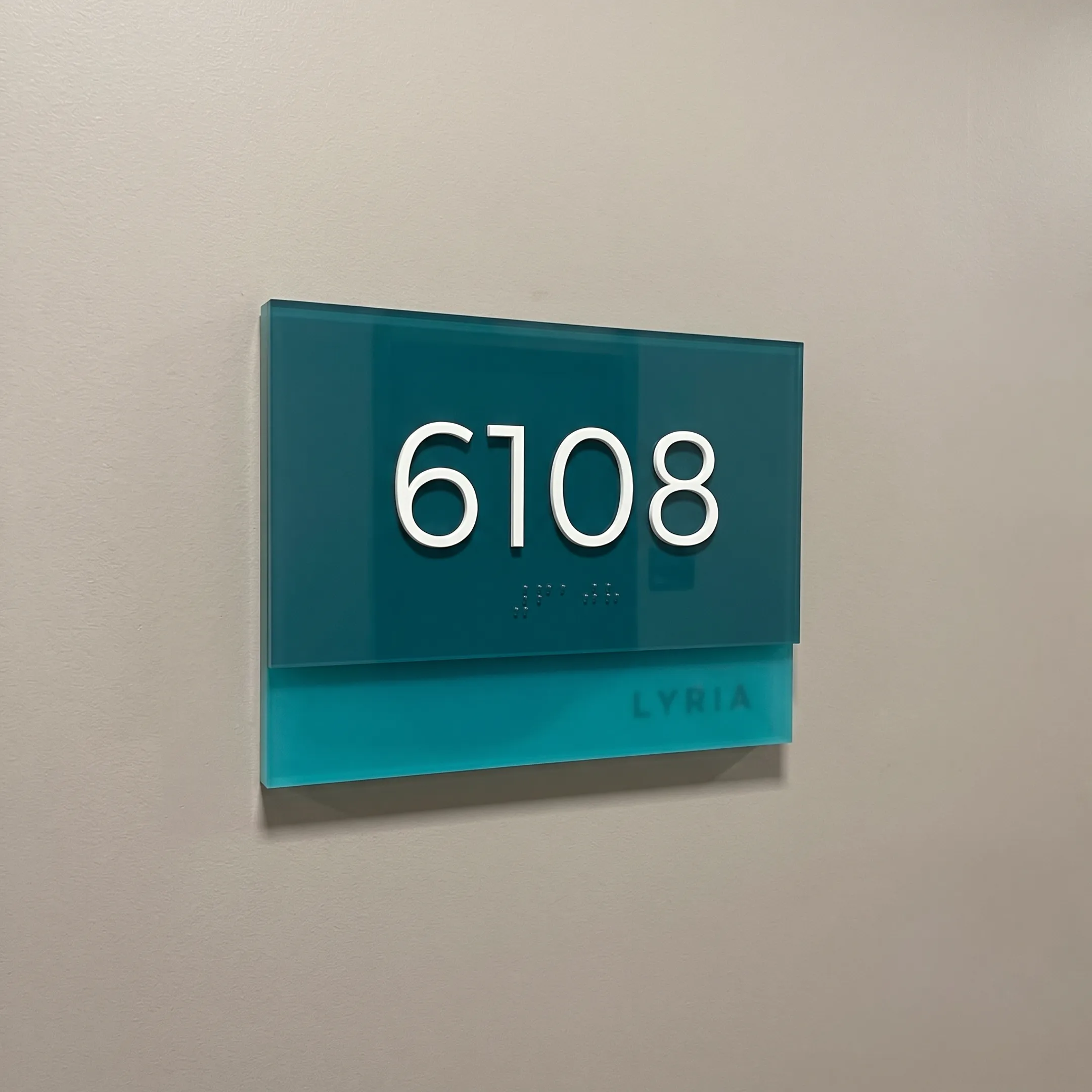 Wholesale ADA compliant tactile and Braille signage displayed in a Baton Rouge commercial facility.