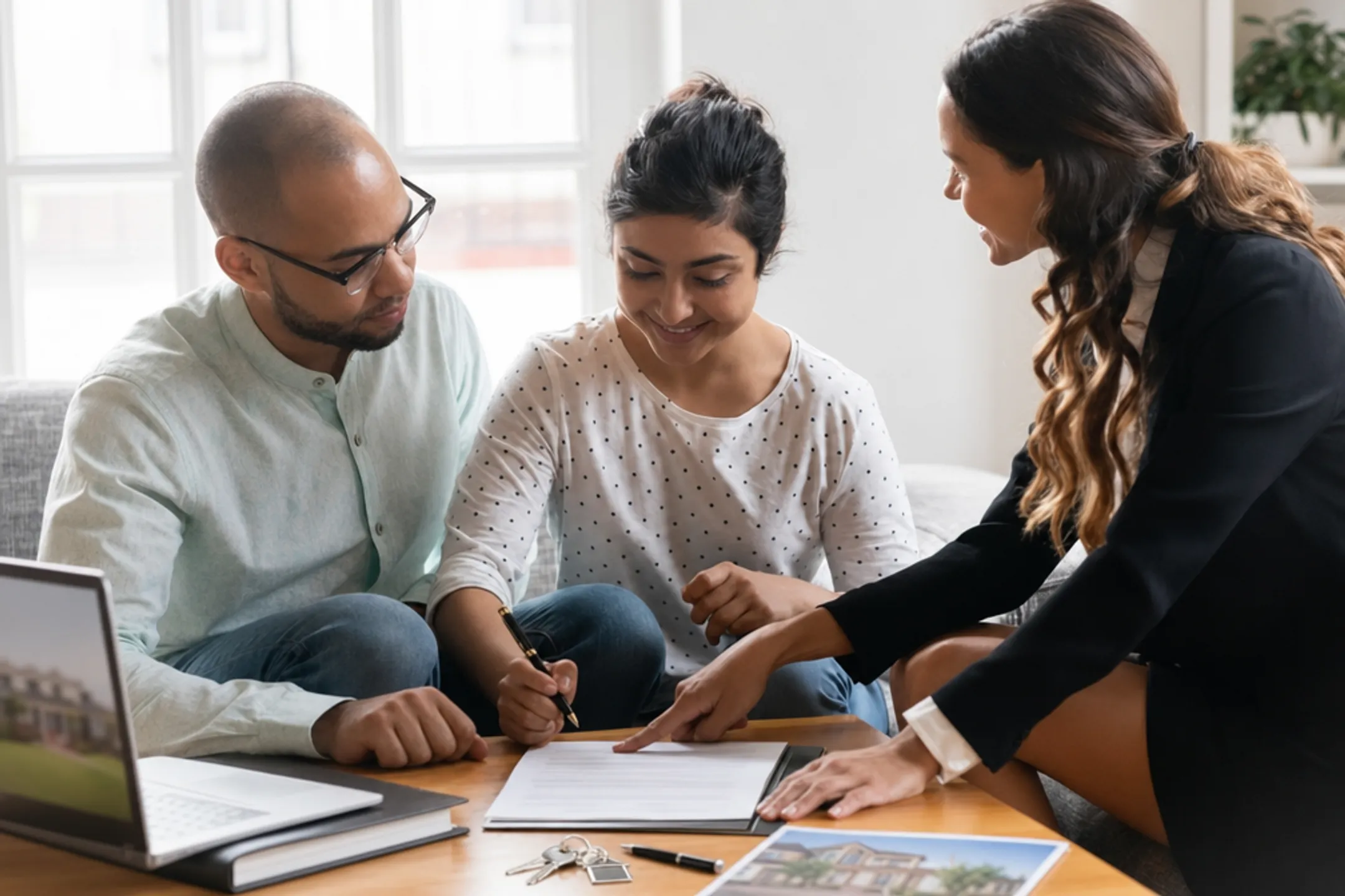 Real estate professionals coordinating inspection appraisal and closing documents