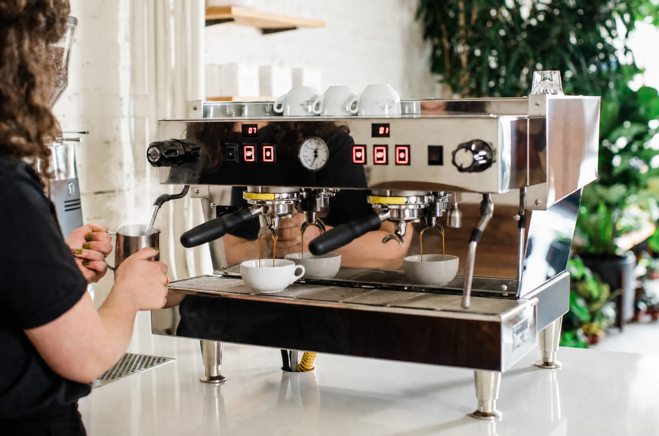 La Marzocco dual boiler commercial espresso machine in busy cafe