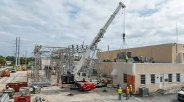 Spinning Crane Works Link-Belt boom crane performing high-reach industrial lift on job site