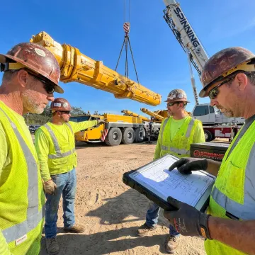 Crane crew planning a heavy lift