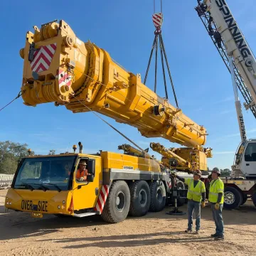 Crane operator preparing industrial rigging lift