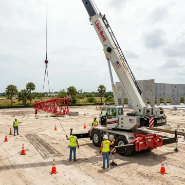 Mobile crane lifting equipment at a Florida commercial construction site
