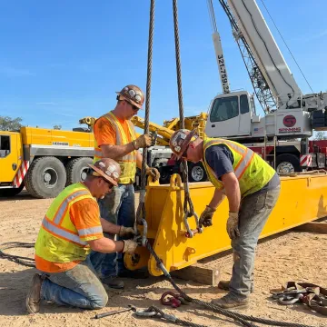 Crane crew rigging industrial equipment