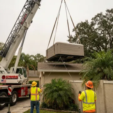 Residential crane lifting equipment at a Florida home
