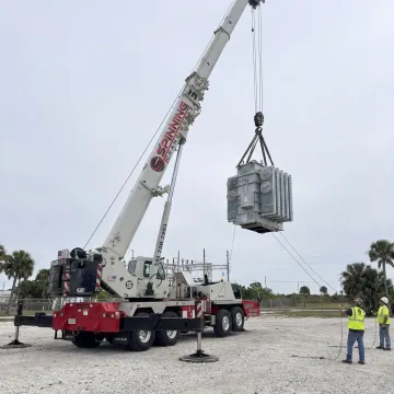 Crane lifting transformer equipment in Florida