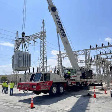 Industrial crane lifting equipment at a Florida power plant