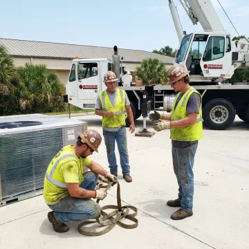 Crane crew preparing a rooftop lift