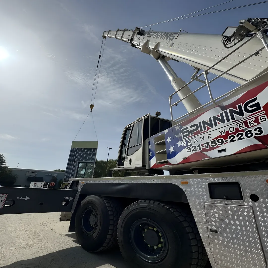 Crane removing fallen tree from Orlando home