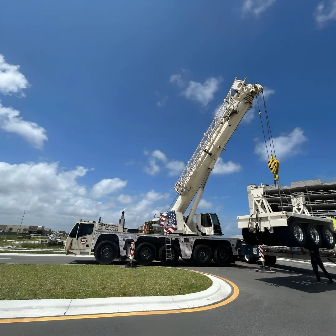 Crane crew preparing a mechanical equipment lift