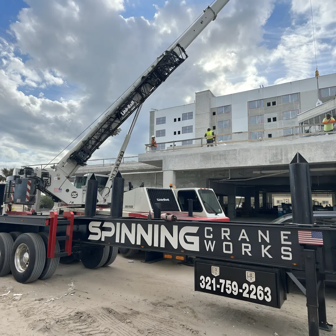 Commercial crane lifting structural steel in Florida