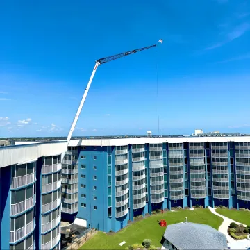 Mobile crane lifting equipment at a Florida commercial construction site
