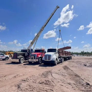 Crane removing a storm-damaged tree in Florida