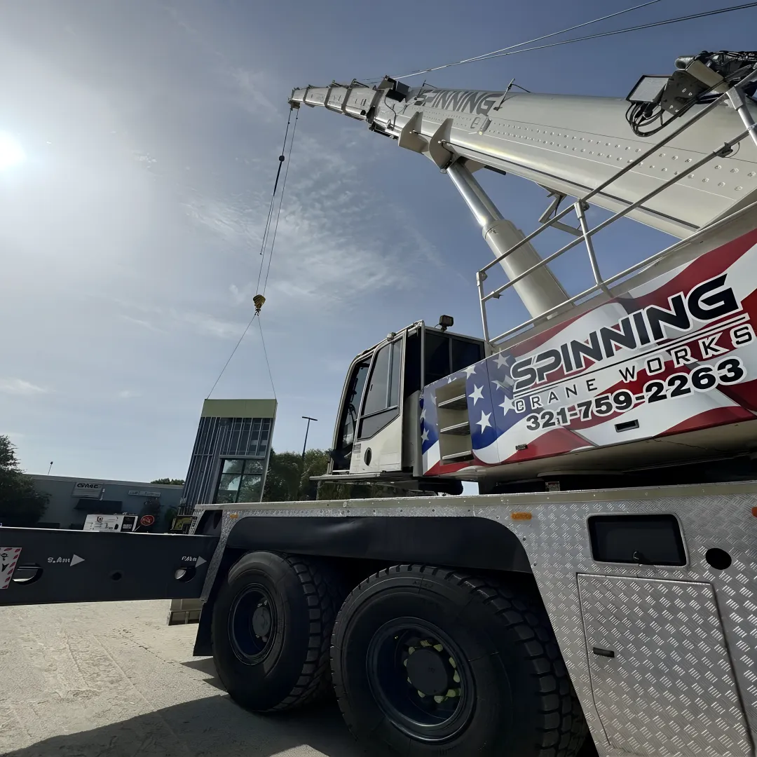 Crane relocating industrial equipment in Florida