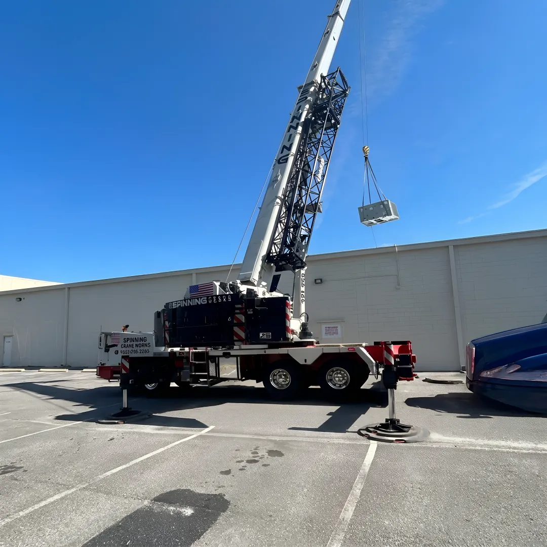 Crane crew planning storm tree removal