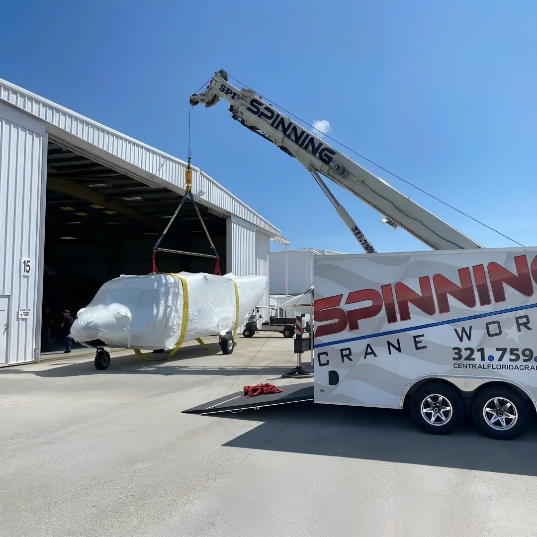 Crane lifting utility equipment in Florida