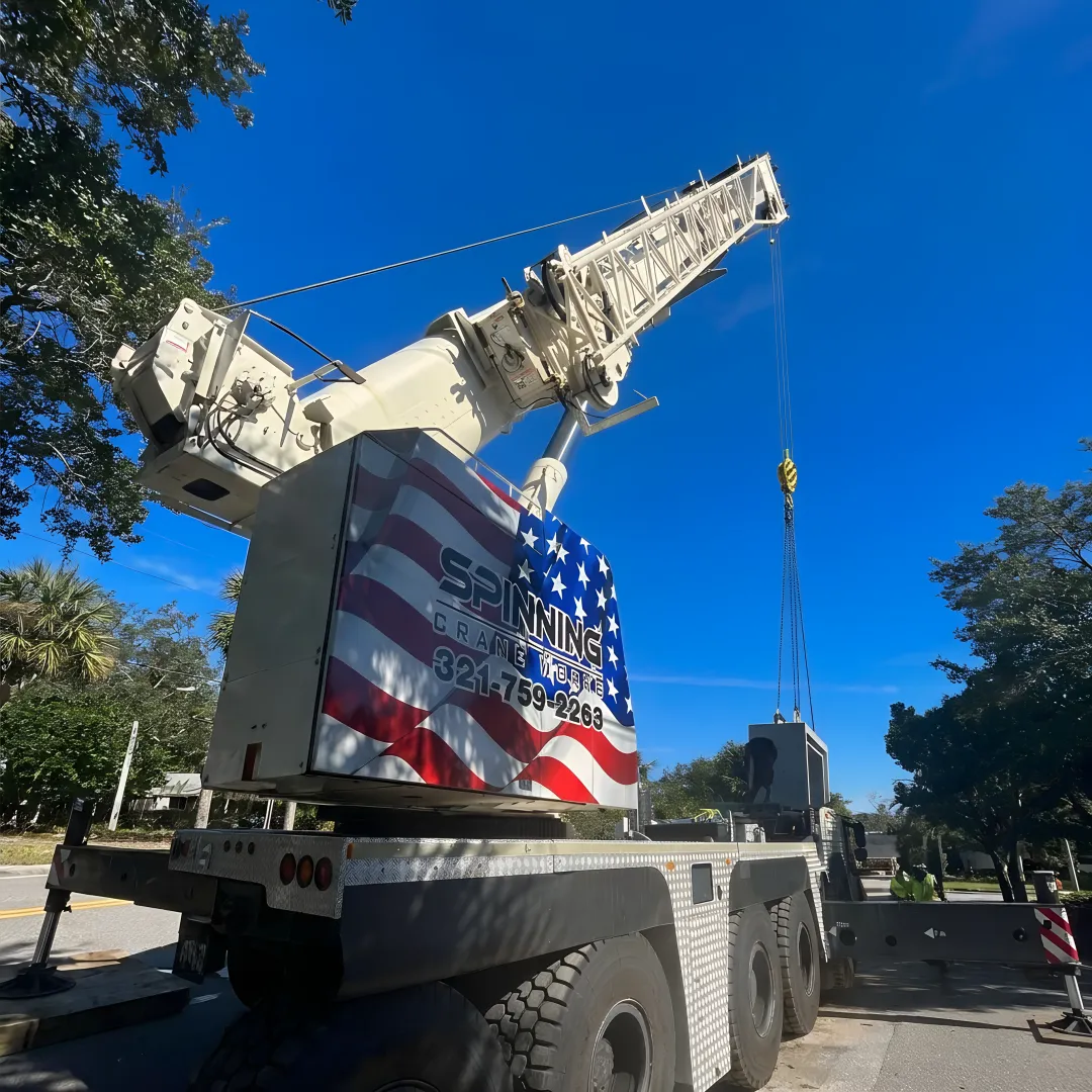 Crane crew preparing rigging before a lift