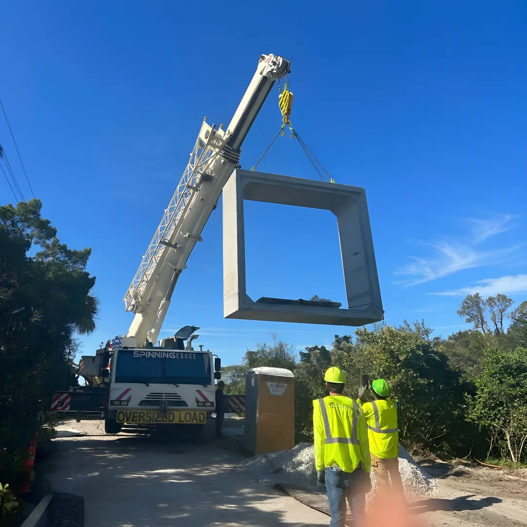 Crane operator planning a tree removal lift