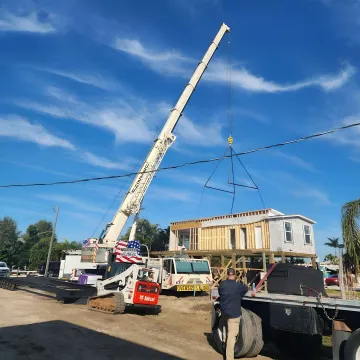 Crane operator preparing industrial rigging lift