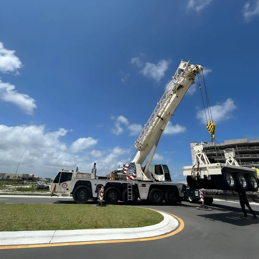 Crane crew preparing rigging before a heavy lift
