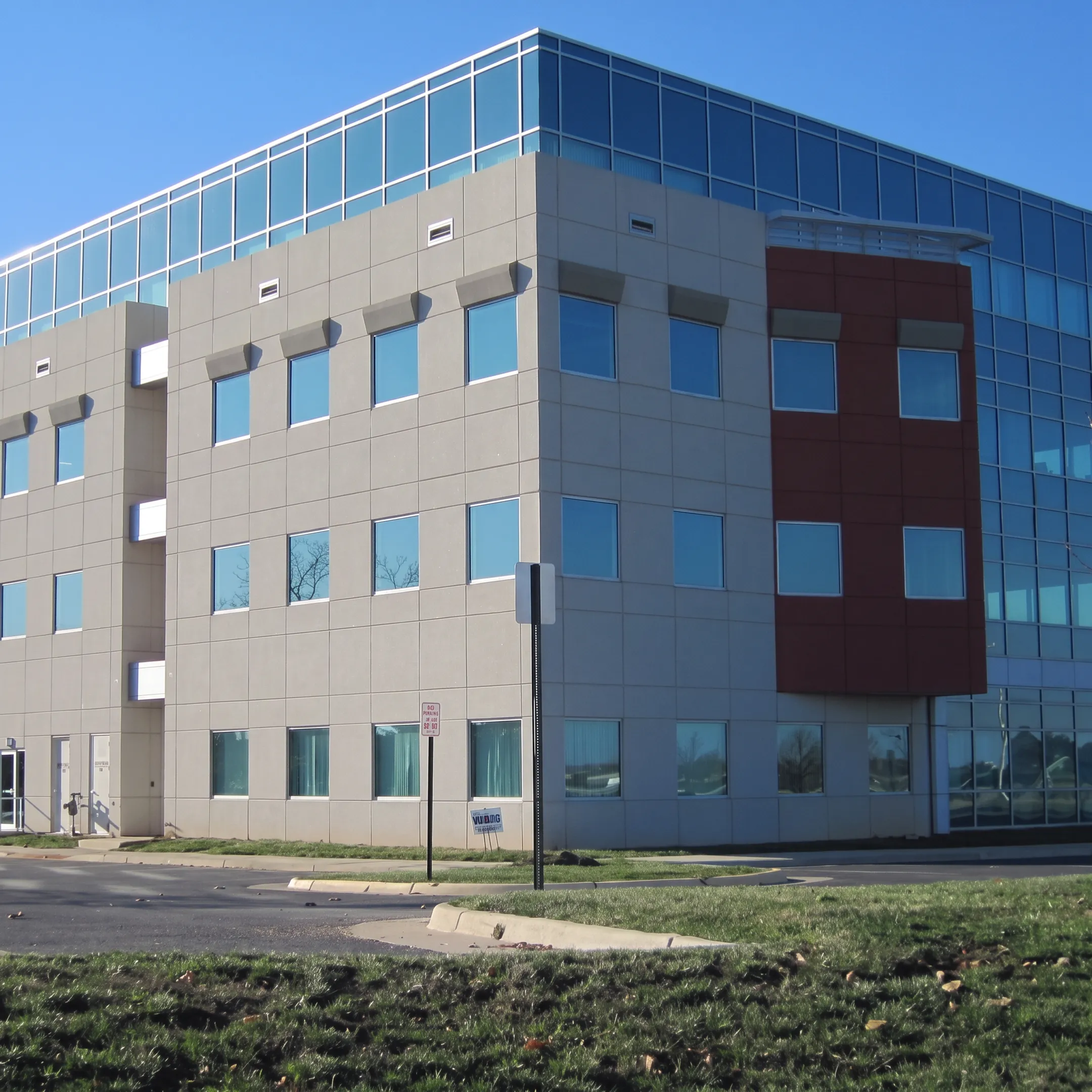 Completed commercial building facade with EIFS and architectural panels