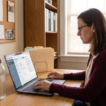 Caseworker using a centralized community services dashboard