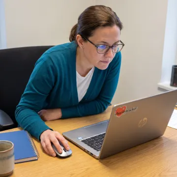 Staff member reviewing a digital client assessment