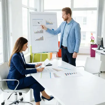 Business broker and client reviewing mid-market business sale documents in a professional office setting.