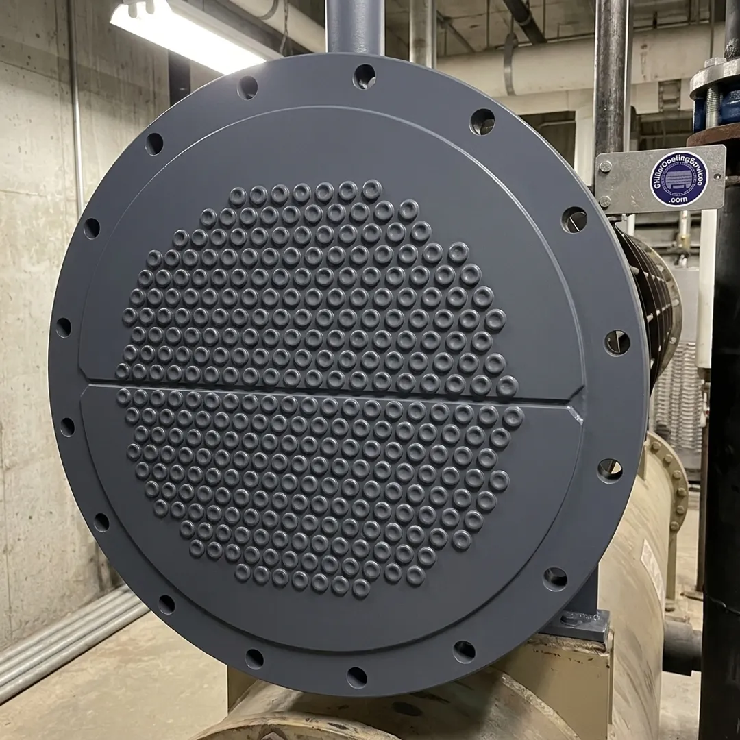 Restored chiller tube sheet with protective coating