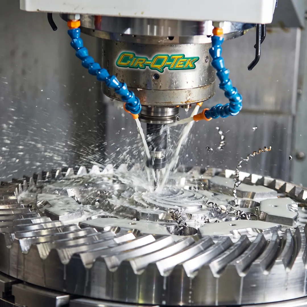CNC machine cutting a stainless steel component