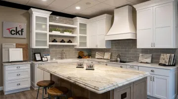 CKF showroom quartzite island display with eased edge profile and cabinetry