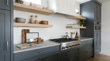 Scandinavian charcoal kitchen with light oak open shelving and pale quartz countertops