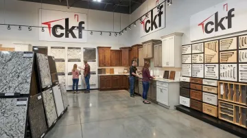 CKF showroom display of countertop slabs cabinets and hardware for bathroom remodels