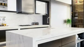 Engineered quartz kitchen countertop with seamless surface and modern cabinetry