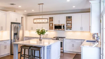 Under-cabinet LED lighting illuminating modern kitchen countertop workspace