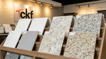 Budget quartz and entry-level granite countertop samples displayed in showroom setting
