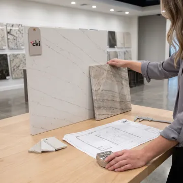 Designer reviewing quartz samples for a bathroom vanity