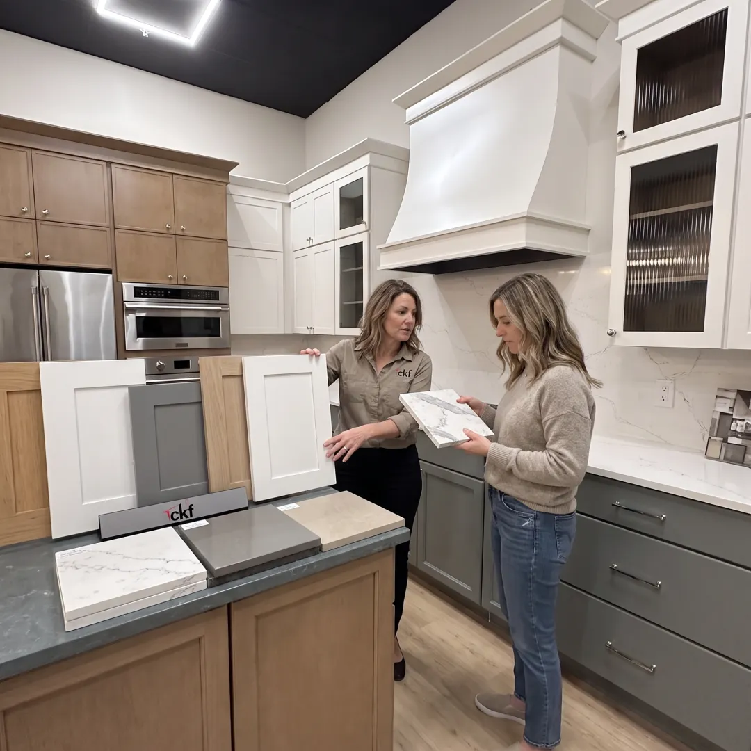 Homeowner selecting cabinet and countertop materials