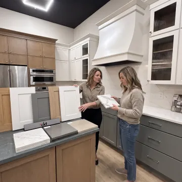 Homeowner selecting cabinet and countertop materials