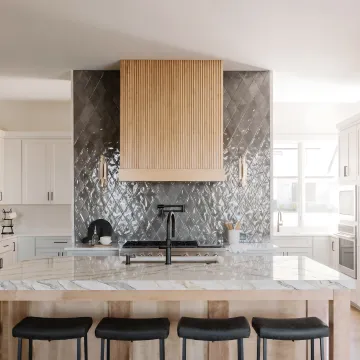 Completed modern kitchen with cabinetry and quartz